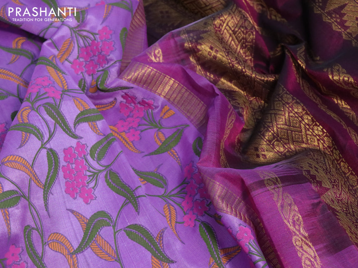 Silk cotton saree lavender shade and deep wine shade with allover floral prints and zari woven korvai border