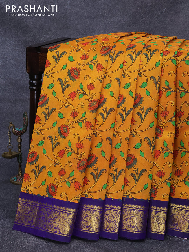 Silk cotton saree mustard yellow and blue with allover floral prints and zari woven korvai border