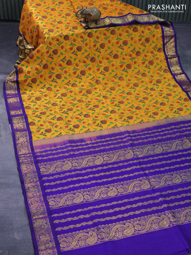 Silk cotton saree mustard yellow and blue with allover floral prints and zari woven korvai border