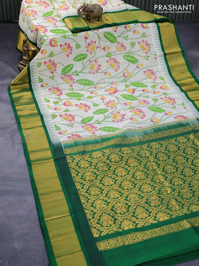 Silk cotton saree cream and green with allover pichwai prints and temple design zari woven border