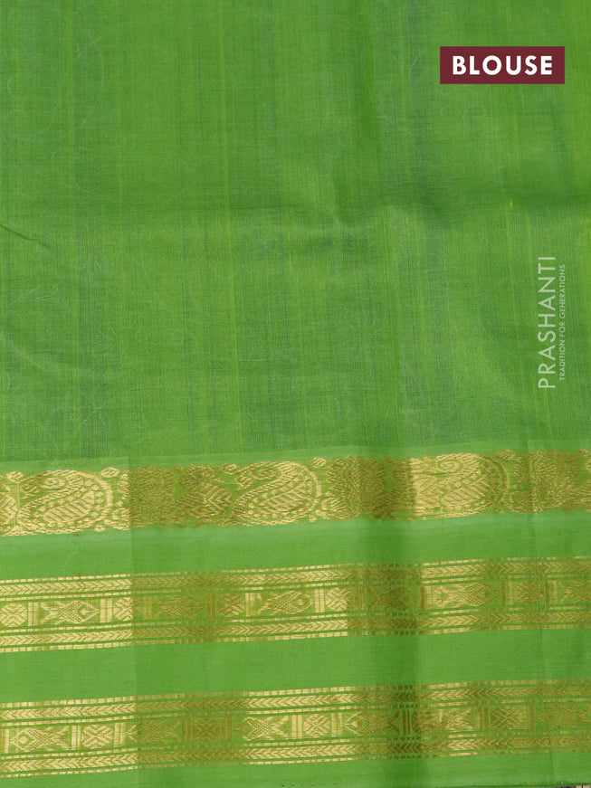 Silk cotton saree blue and light green with allover floral prints and rettapet zari woven korvai border