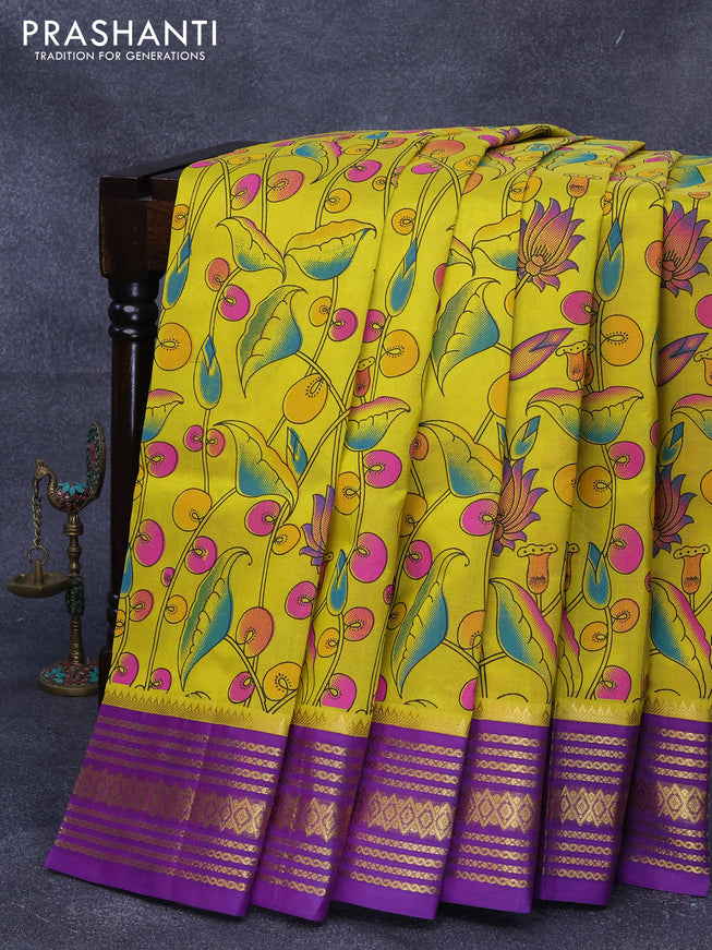 Silk cotton saree yellow and purple with allover pichwai prints and zari woven korvai border