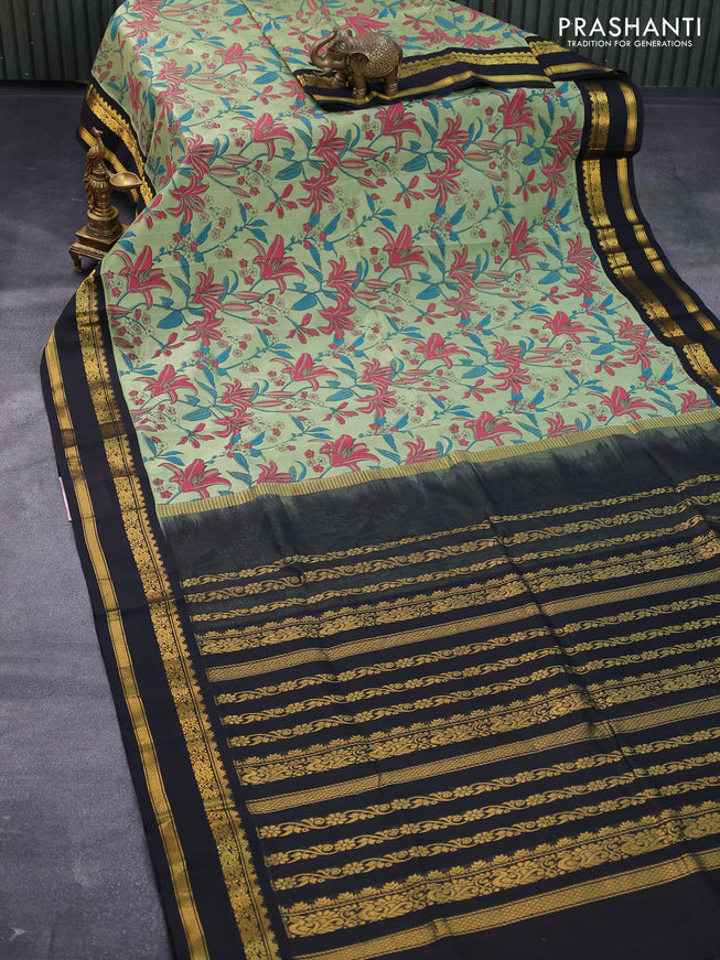 Silk cotton saree pastel green and black with allover floral prints and rettapet zari woven korvai border
