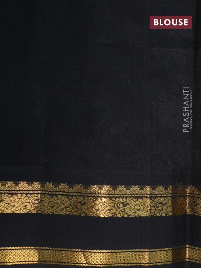 Silk cotton saree pastel green and black with allover floral prints and rettapet zari woven korvai border