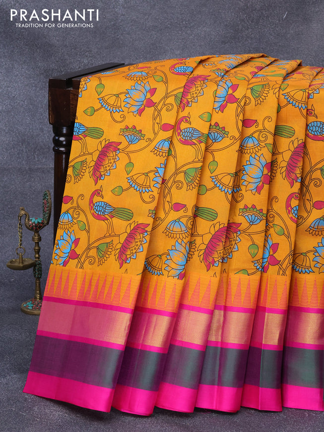Silk cotton saree mustard yellow and pink with allover kalamkari prints and temple design zari woven simple border