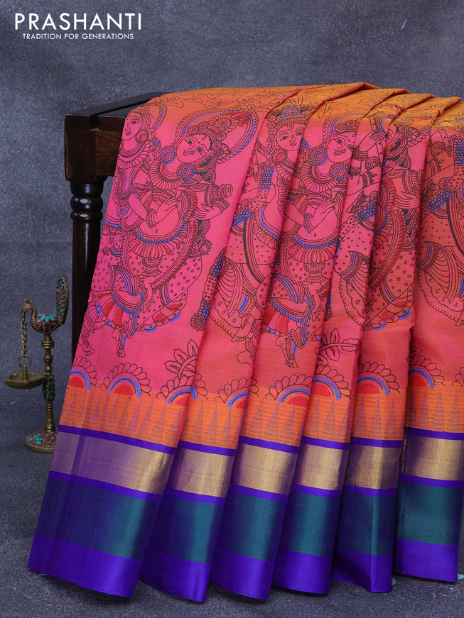 Silk cotton saree dual shade of pinkish orange and blue with allover kalamkari prints and temple design zari woven simple border