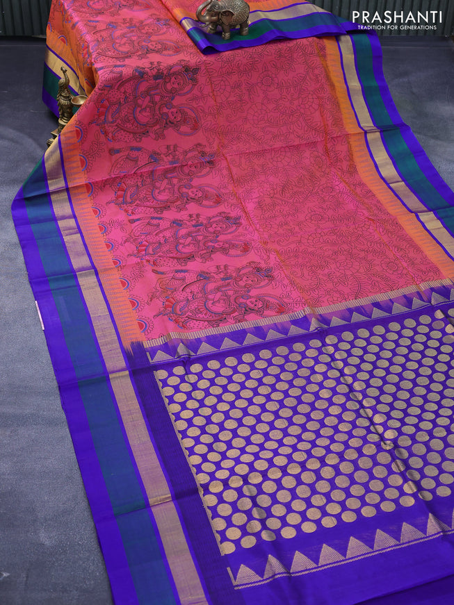 Silk cotton saree dual shade of pinkish orange and blue with allover kalamkari prints and temple design zari woven simple border