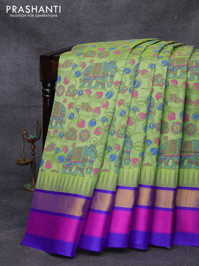 Silk cotton saree light green and blue with allover kalamkari prints and temple design zari woven simple border