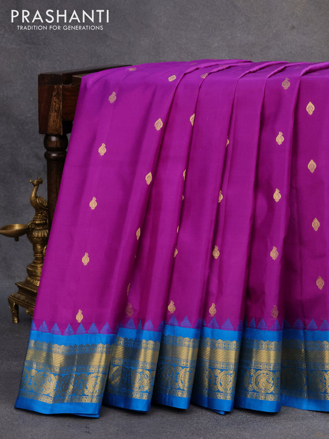 Pure gadwal silk saree deep purple and cs blue with zari woven buttas and temple design zari woven border