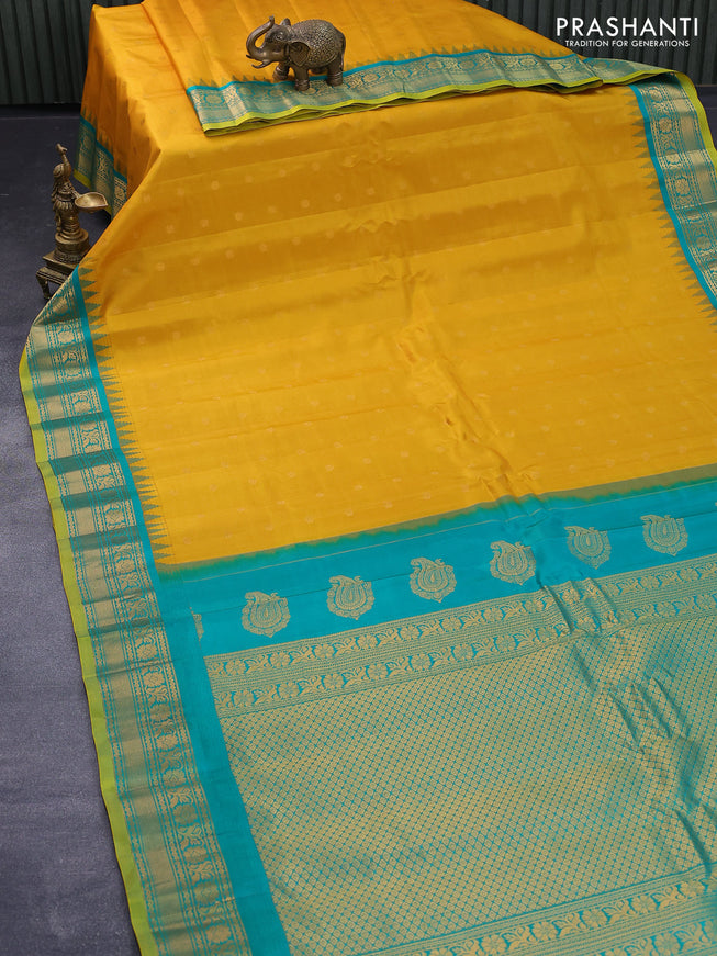 Pure gadwal silk saree mustard yellow and green with zari woven buttas and temple design zari woven border