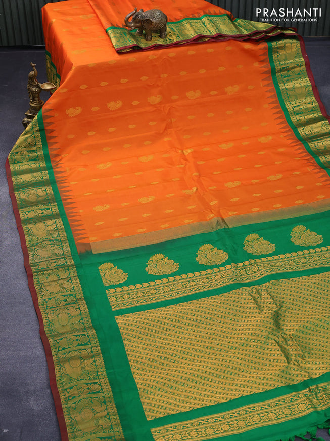 Pure gadwal silk saree orange and green with zari woven buttas and temple design annam zari woven border