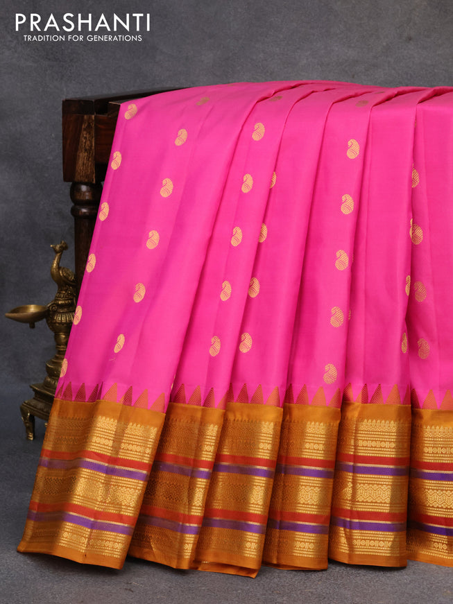 Pure gadwal silk saree pink and mustard shade with allover stripes pattern and temple design zari woven border