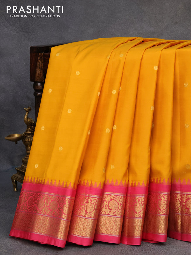Pure gadwal silk saree mustard yellow and pink with zari woven buttas and temple design floral zari woven border