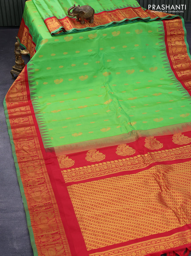 Pure gadwal silk saree light green and red with zari woven buttas and temple design annam zari woven border