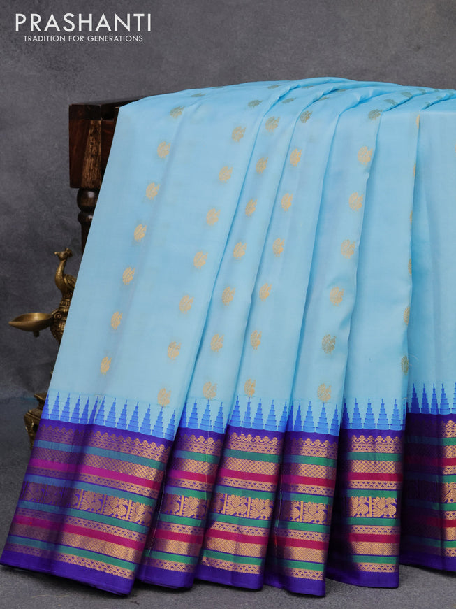 Pure gadwal silk saree light blue and blue with annam zari woven buttas and temple design zari woven border