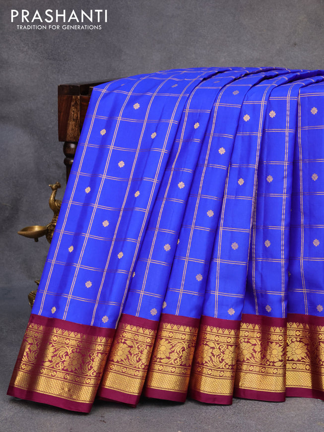 Pure gadwal silk saree blue and deep purple with allover zari checks & buttas and zari woven border