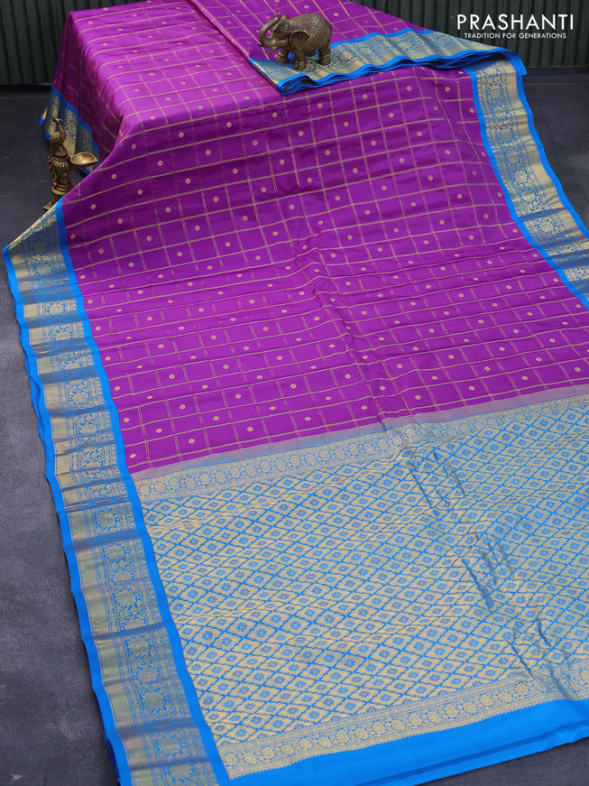 Pure gadwal silk saree purple and cs blue with allover zari checks & buttas and zari woven border