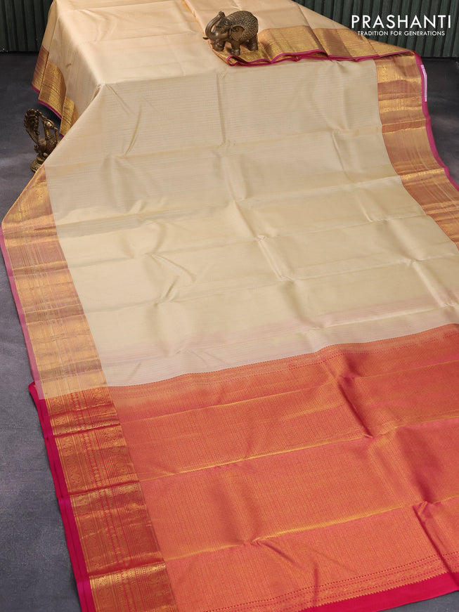 Pure kanjivaram silk saree sandal and pink with allover self emboss and zari woven border