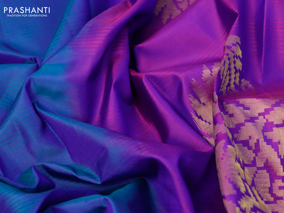 Pure kanjivaram silk saree dual shade of bluish green and purple with plain body and zari woven butta border