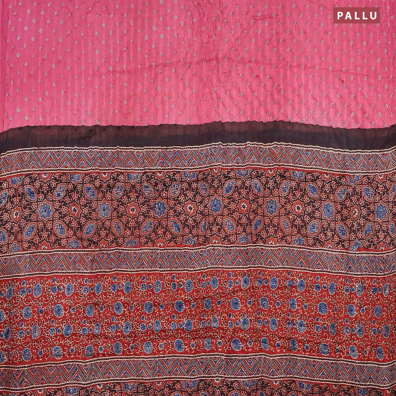Modal silk saree pink and maroon with allover bandhani prints and ajrakh printed pallu