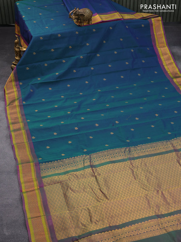 Gadwal silk cotton saree dual shade od bluish green and dual shade of purple with zari woven leaf buttas and zari woven border