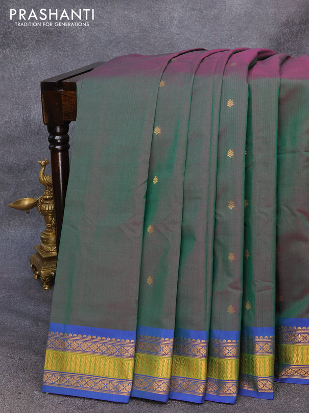 Gadwal silk cotton saree dual shade of greenish purple and blue with allover zari woven buttas and zari woven border