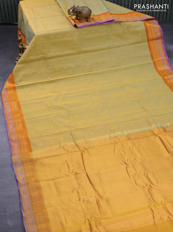 Gadwal silk cotton saree dual shade of yellow and dark mustard with allover zari woven buttas and floral zari woven border