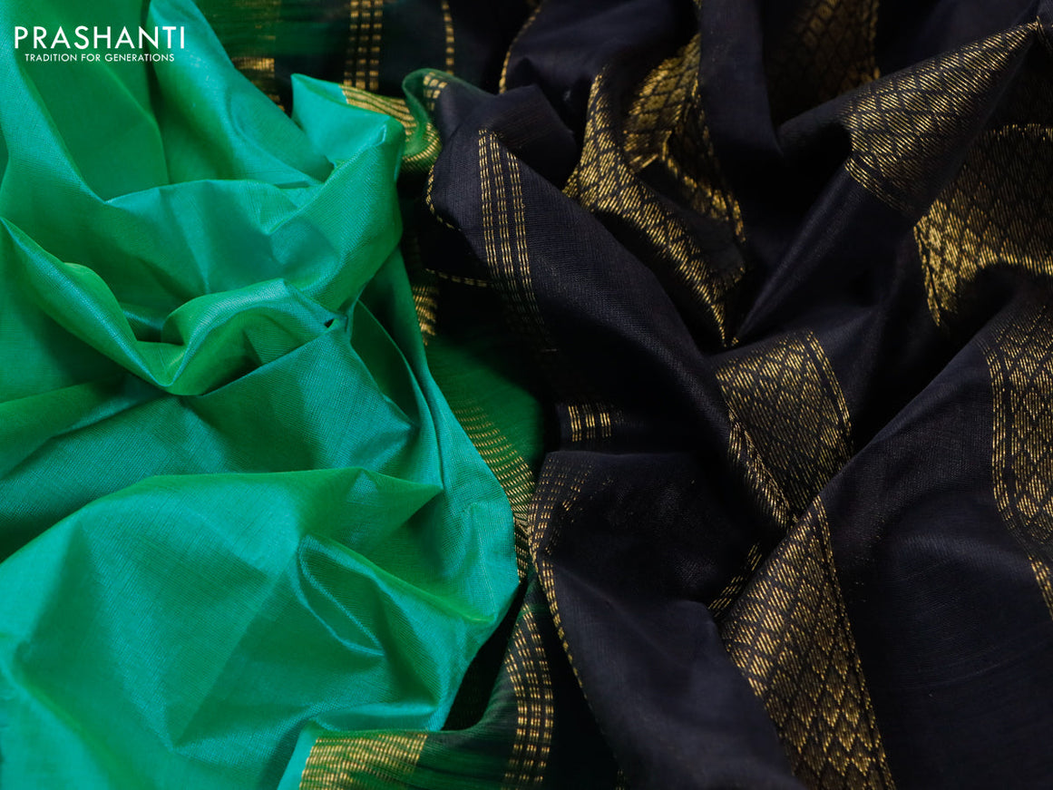 Silk cotton saree green and black with plain body and zari woven korvai border
