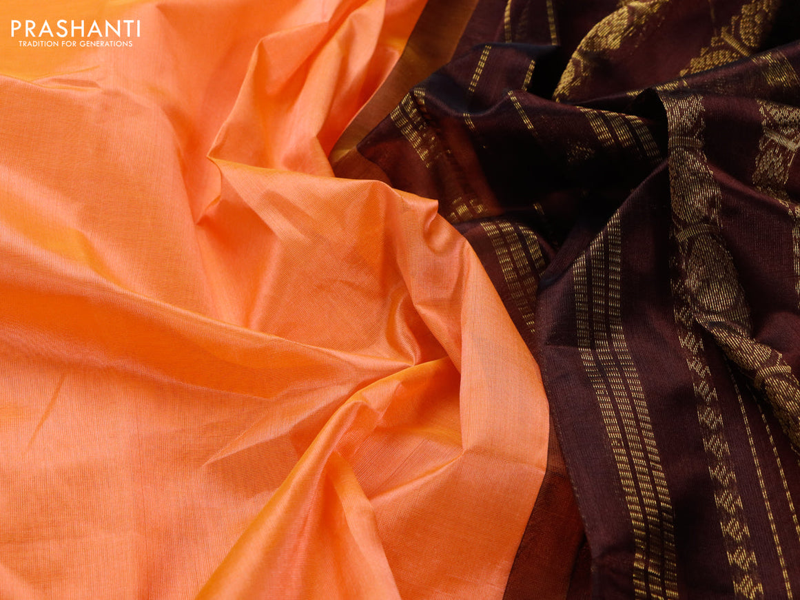 Silk cotton saree peach orange and deep brown with plain body and rettapet zari woven korvai border