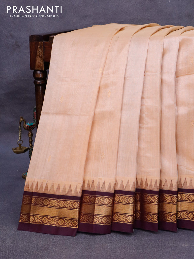 Silk cotton saree sandal and wine shade with zari woven buttas and temple design zari woven border