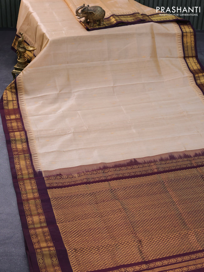 Silk cotton saree sandal and wine shade with zari woven buttas and temple design zari woven border