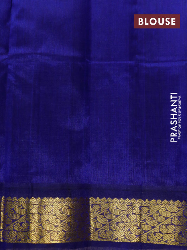 Silk cotton saree light green and blue with plain body and zari woven korvai border