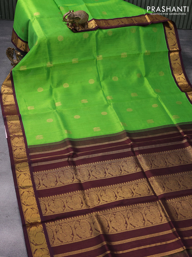Silk cotton saree parrot green and coffee brown with annam & rudhraksha zari woven buttas and annam zari woven korvai border