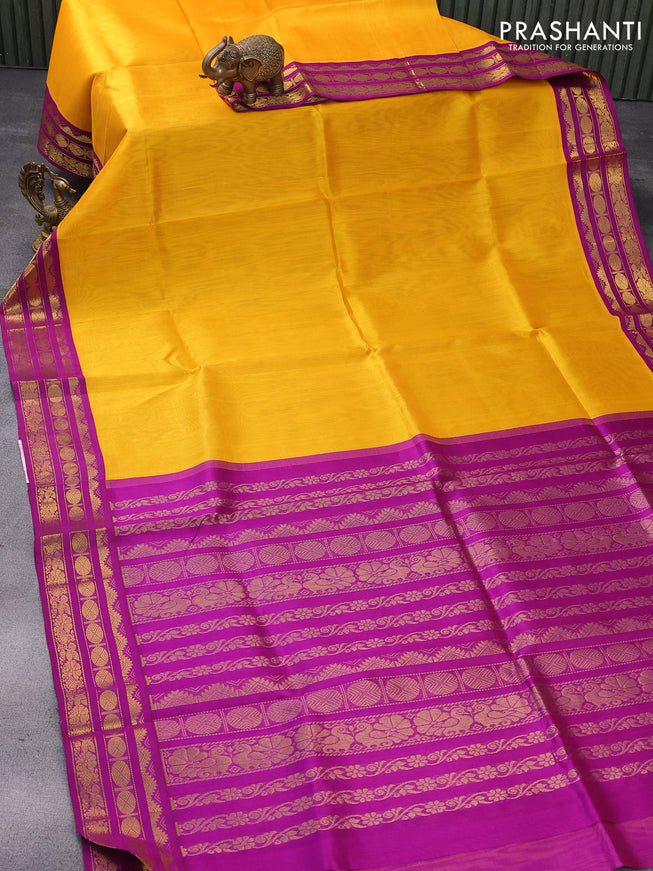 Silk cotton saree mango yellow and purple with plain body and zari woven korvai border