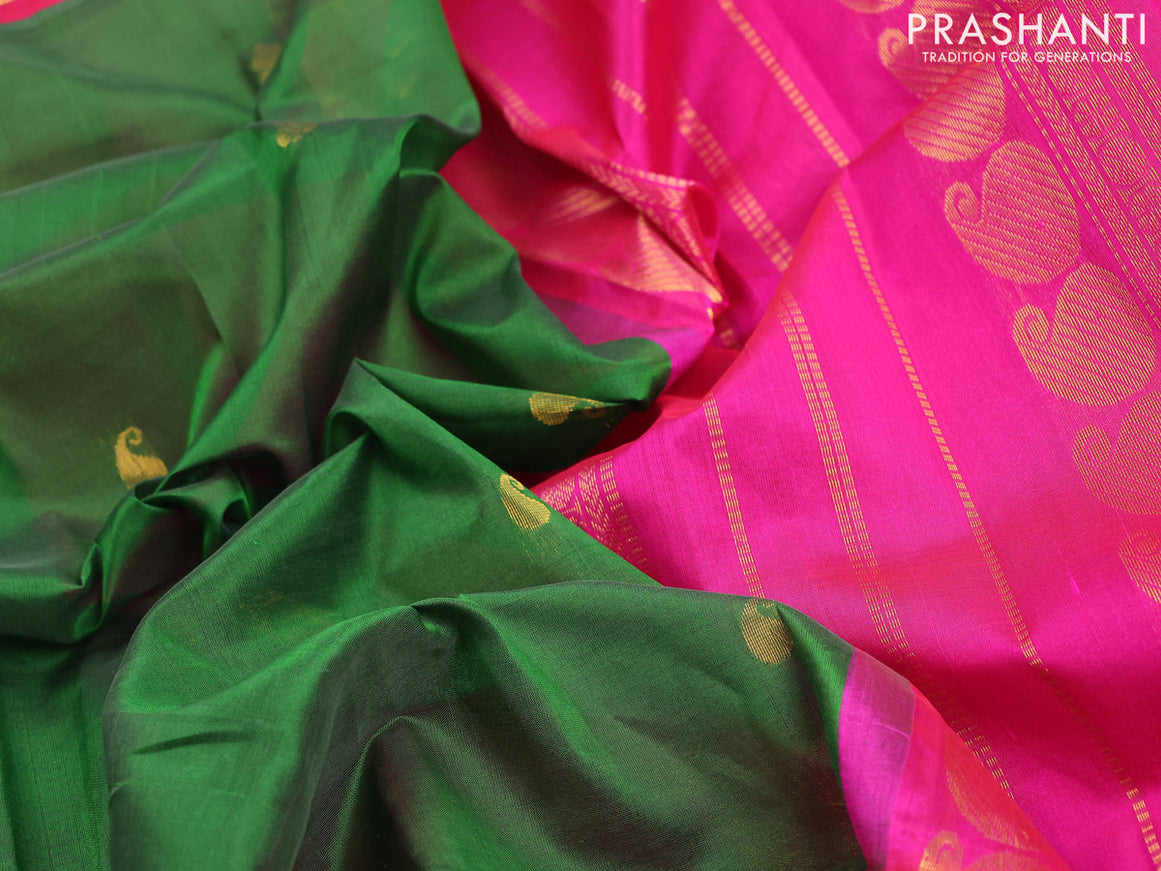 Silk cotton saree dark green and magenta pink with paisley zari woven buttas and long zari woven border