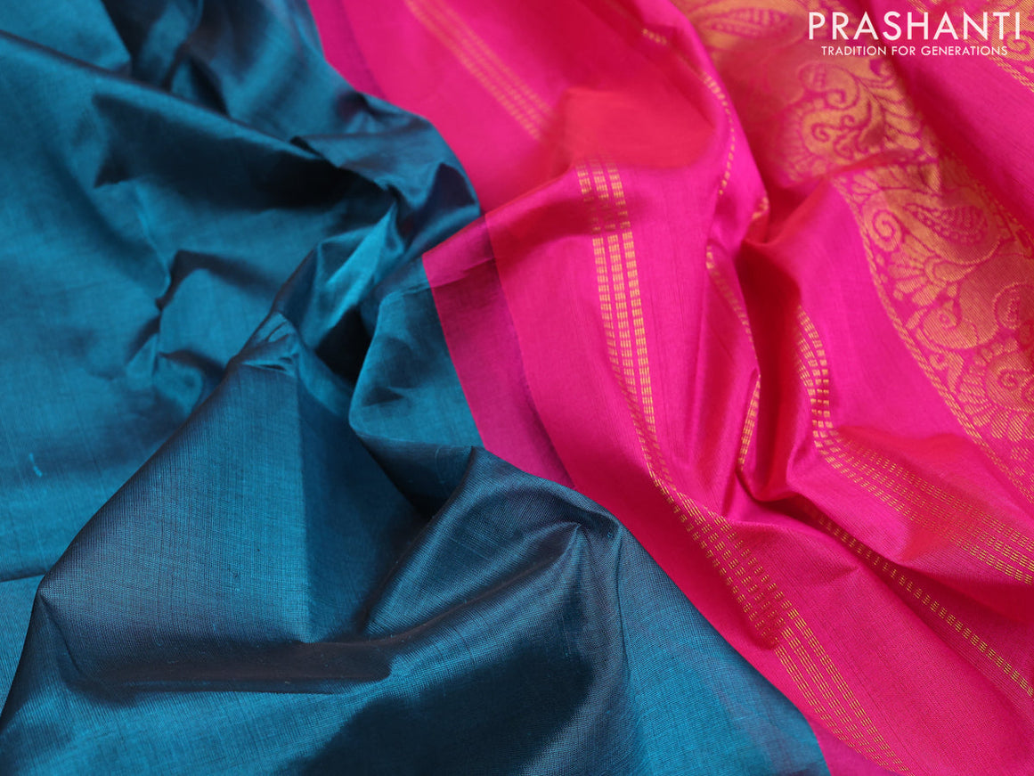 Silk cotton saree peacock blue and pink with plain body and annam & paisley zari woven korvai border