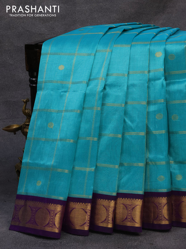 Silk cotton saree teal blue and violet with allover zari checks & buttas and rudhraksha zari woven korvai border