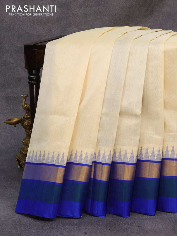 Kuppadam silk cotton saree cream and blue with plain body and temple design zari woven simple border