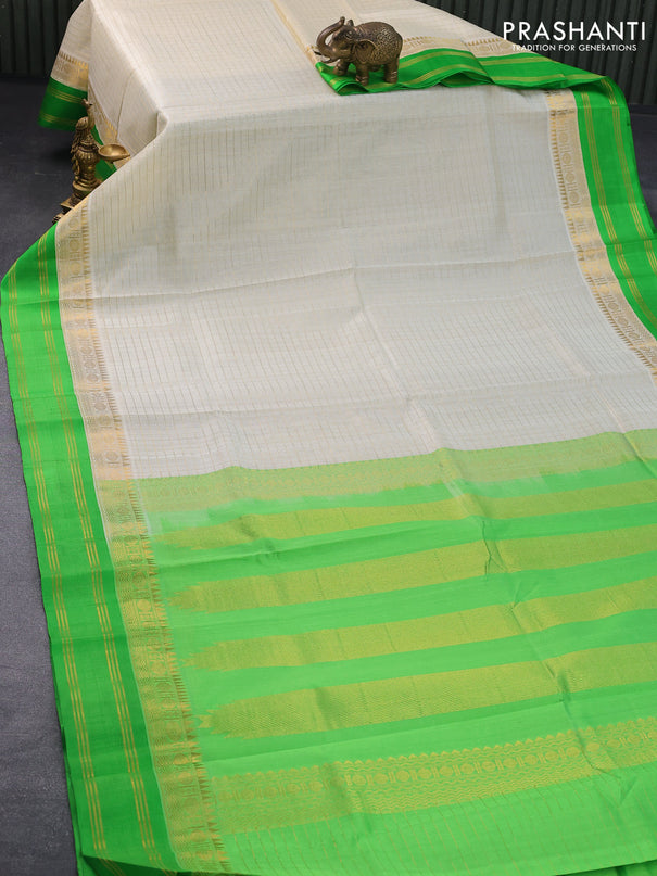 Kuppadam silk cotton saree off white and light green with allover zari checked pattern and temple design zari woven simple border