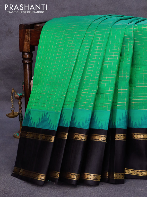 Kuppadam silk cotton saree dual shade of teal bluish green and black with allover zari checked pattern and temple design rettapet zari woven border