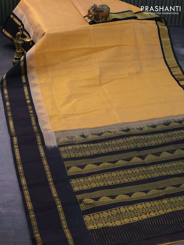Kuppadam silk cotton saree sandal and black with allover zari checked pattern and temple design rettapet zari woven border