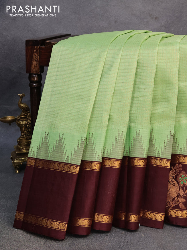 Kuppadam silk cotton saree pista green and brown with allover zari checked pattern and rettapet zari woven butta border