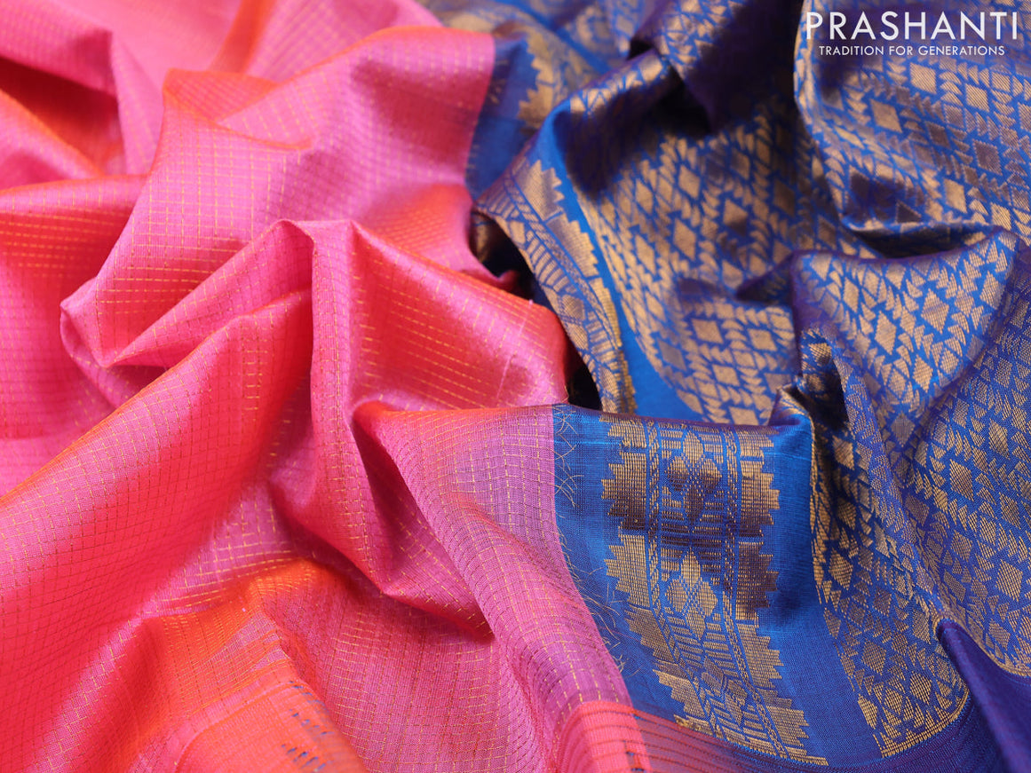 Kuppadam silk cotton saree dual shade of pinkish orange and blue with allover zari checked pattern and rettapet zari woven butta border