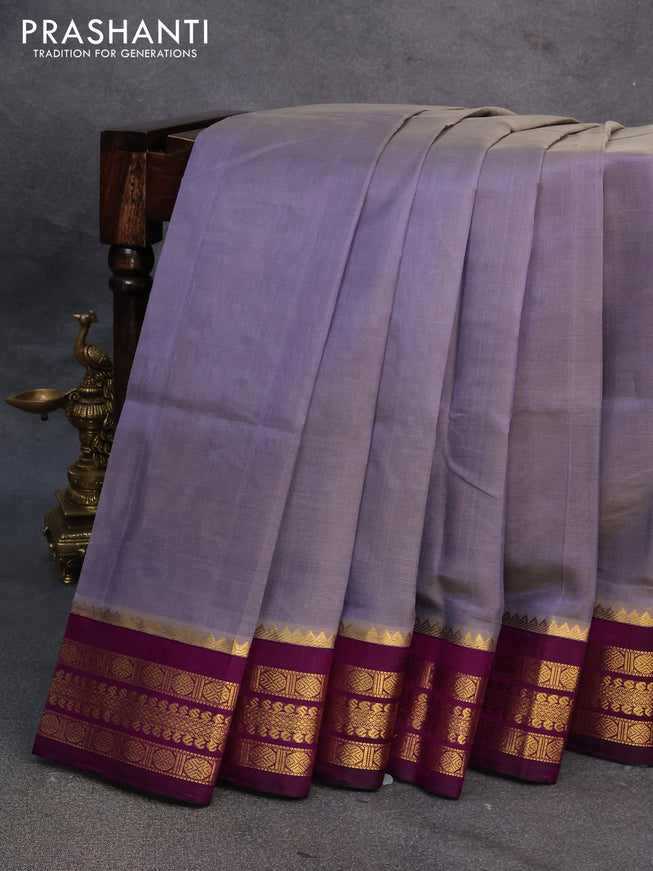 Kuppadam silk cotton saree dual shade of bluish grey and purple with plain body and zari woven border