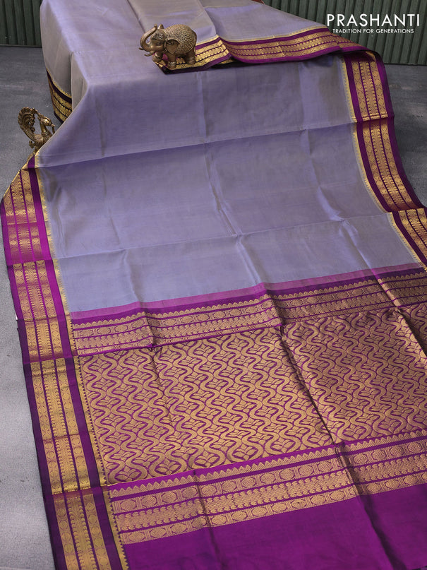 Kuppadam silk cotton saree dual shade of bluish grey and purple with plain body and zari woven border