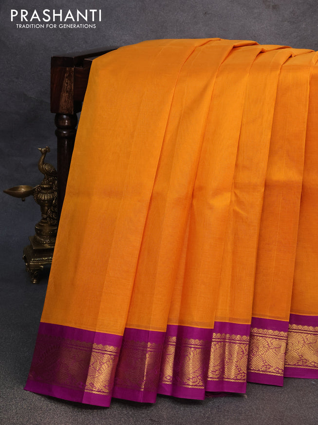 Silk cotton saree mustard yellow and purple with plain body and annam zari woven korvai border