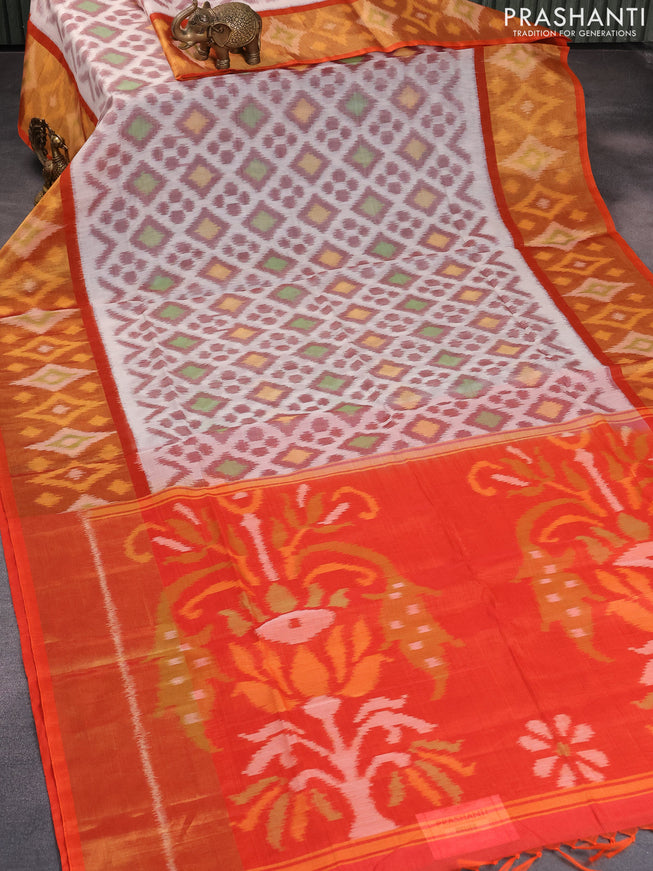 Ikat silk cotton saree off white and orange with allover ikat weaves and long ikat woven border