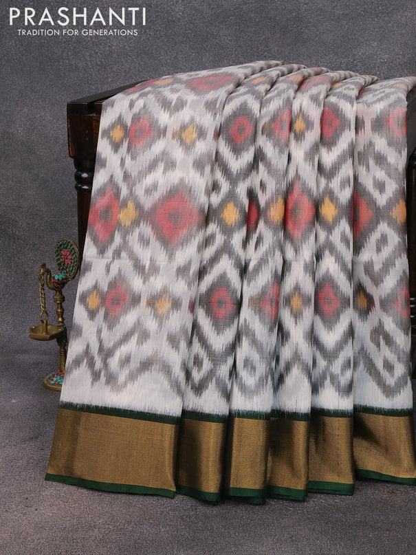 Ikat silk cotton saree off white and dark green with allover ikat weaves and zari woven border