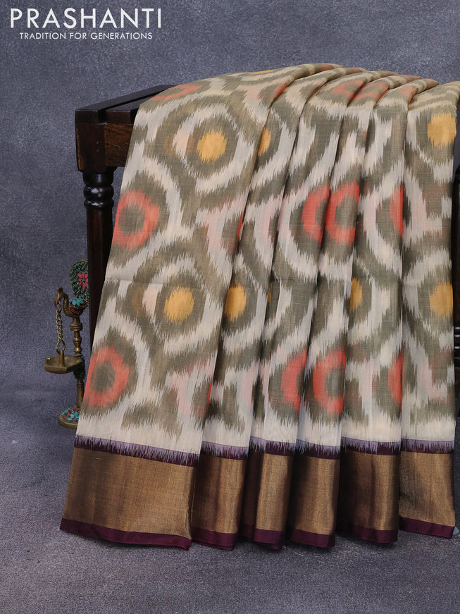 Ikat silk cotton saree cream and deep coffee brown with allover ikat weaves and zari woven border
