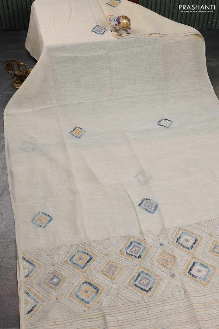 Tissue linen cotton saree cream and sandal with embroidery buttas and embroidery pallu